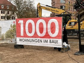 Banner zeigt 1000 Wohnungen im Bau